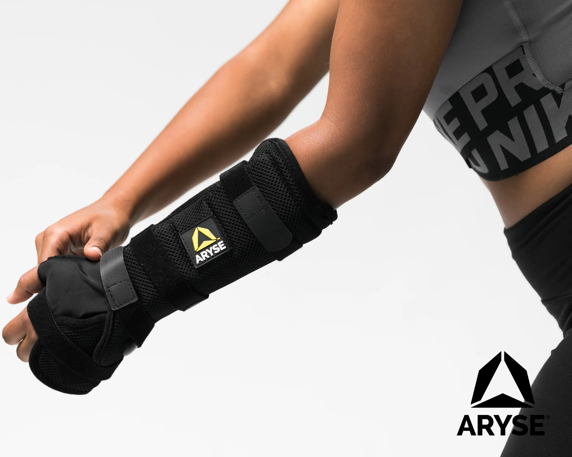 Black wrist brace worn on the hand and forearm